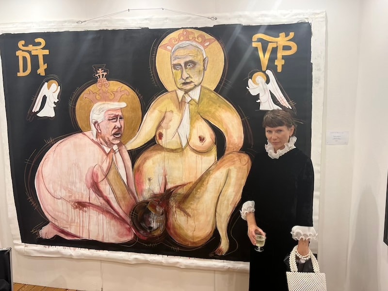 Marina Orlova with provocative religious iconography artwork in studio